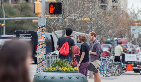 Austin pedestrians waiting to cross the street