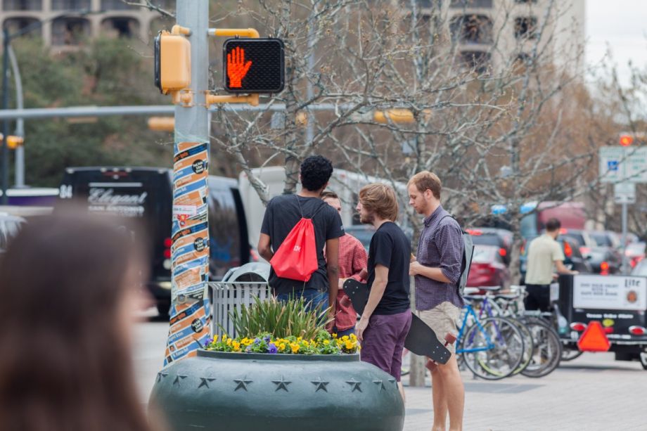 Austin pedestrians waiting to cross the street