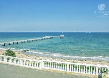 a long pier on a beach