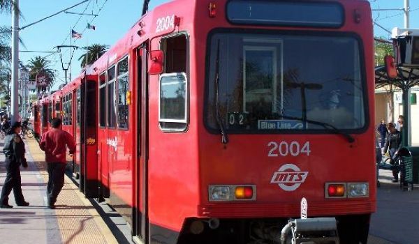 Person boarding a red trolley