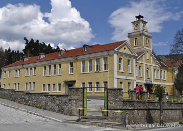 a yellow building with a clock tower