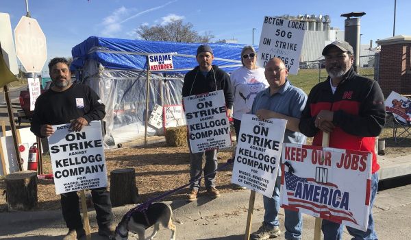 Striking Kellogg's workers Michael Rodarte, Sue Griffin, Michael Elliott, Eric Bates and Mark Gonzalez stand outside the Omaha, Neb., cereal plant Thursday, Dec. 2, 2021.