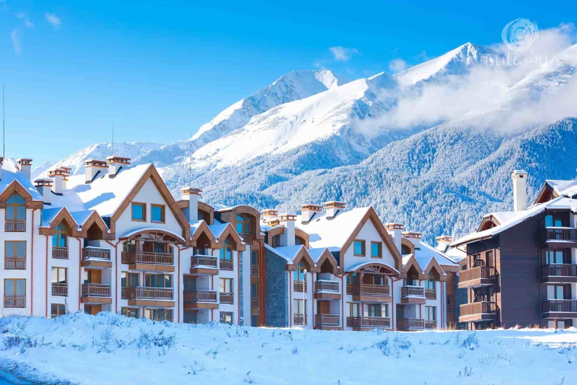 Snowy mountain side with ski resort in winter