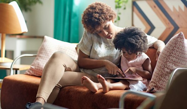 Woman reading to child