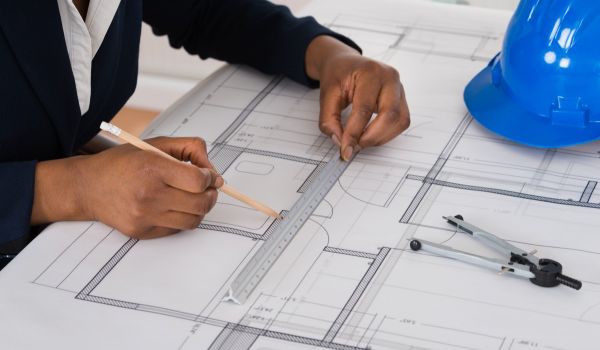 A woman architect working on plans