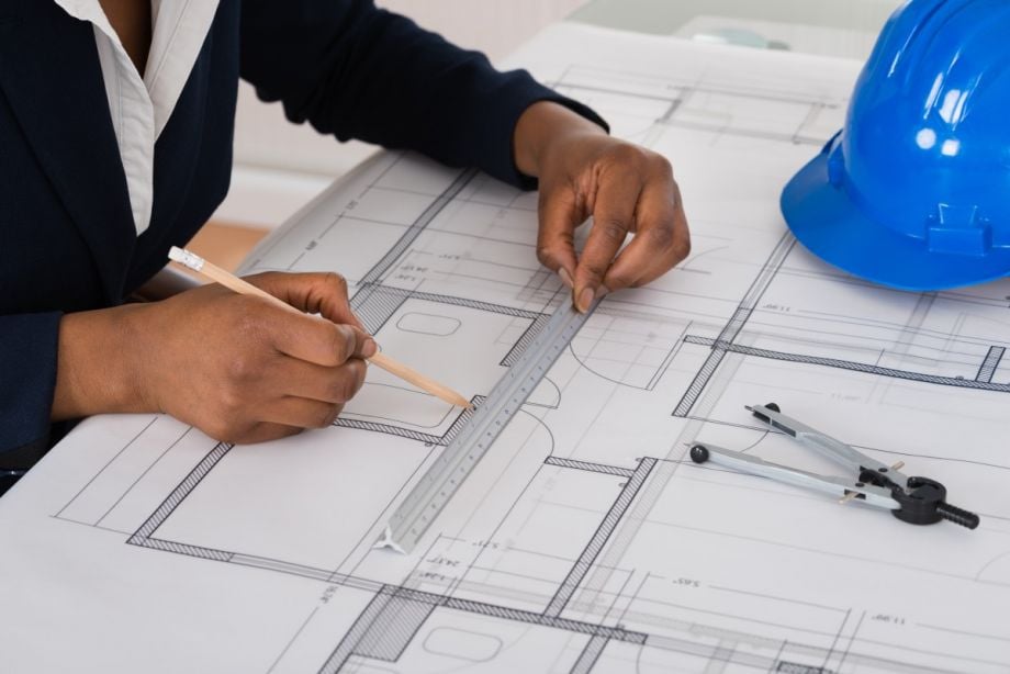 A woman architect working on plans