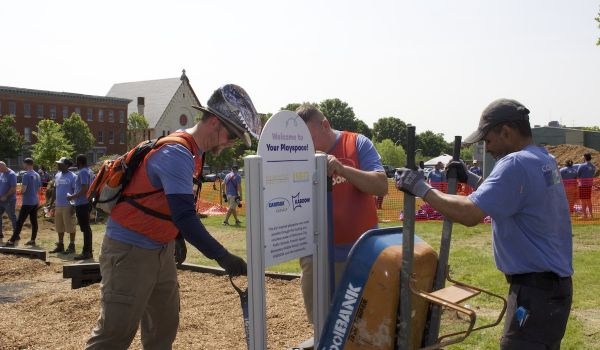 KABOOM! volunteers upload playground sign