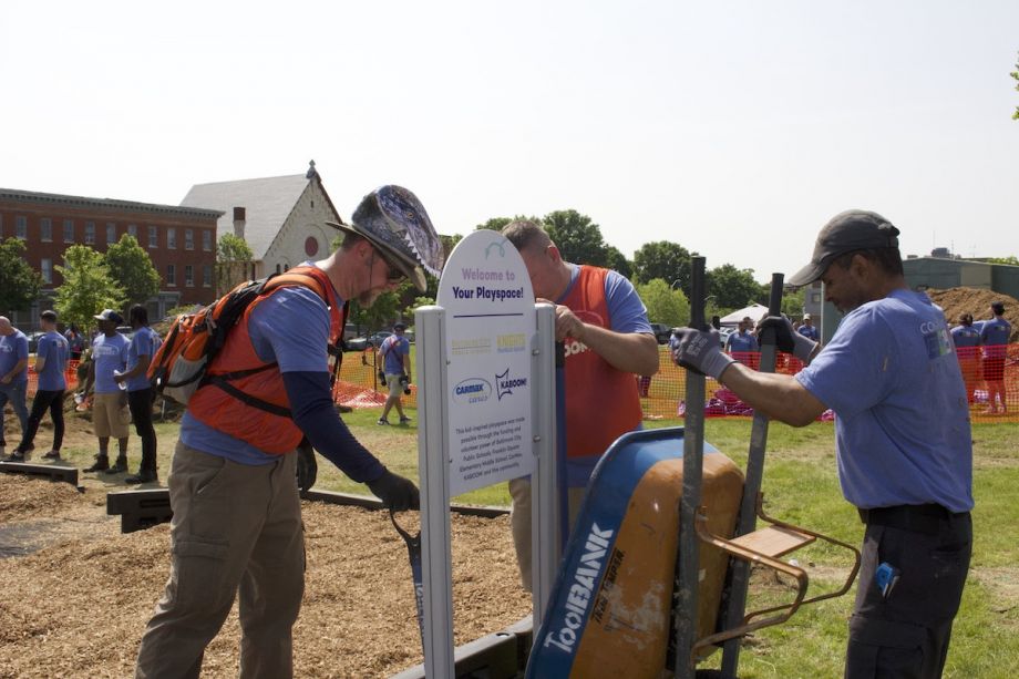 KABOOM! volunteers upload playground sign