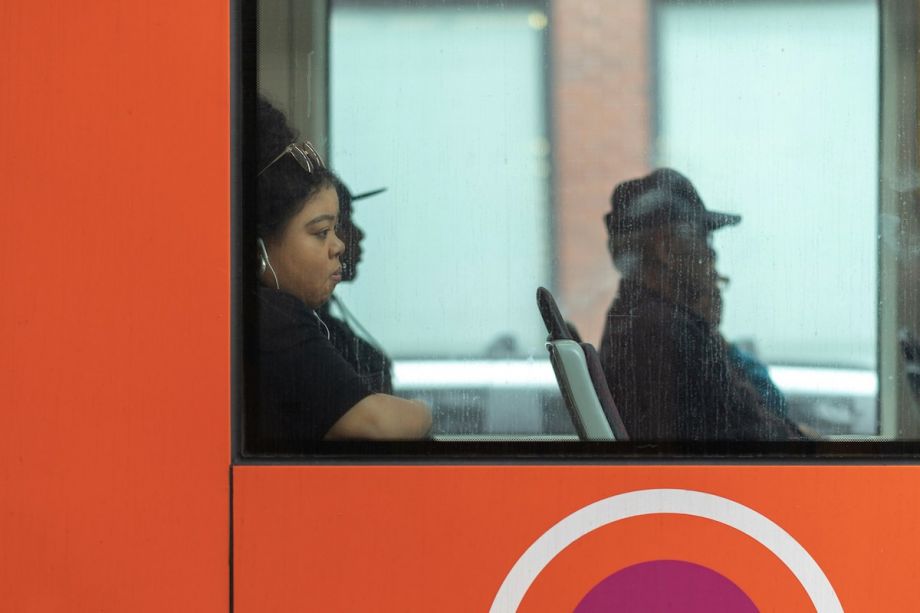 A woman riding on public transportation.