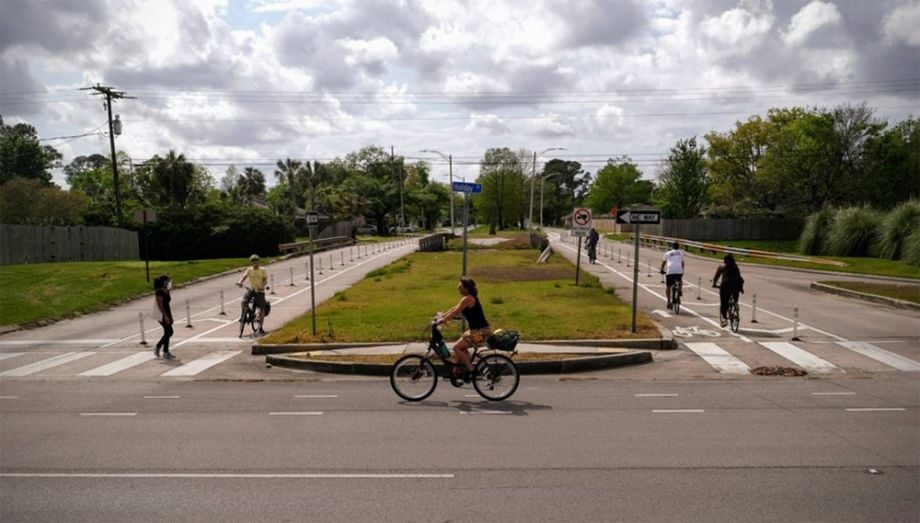 Woman rides bike in New Orleans.