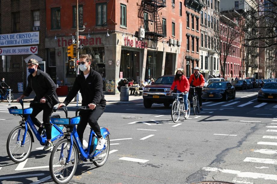 People bicycle in New York City street