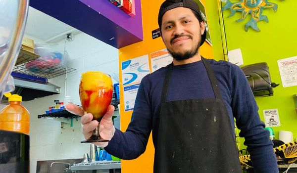 Carlos Lopez prepares a fresh mangonada at The Michigan Squeeze Station,